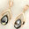 Black long dangly rose gold stud earrings